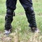 Shin guard made of hard black plastic on the uniform trousers of a German police officer