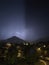 Shine and thunderstorm above mountain and city