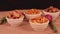 shing bhujia and chanadal with bhakharvadi on wooden table,Indian Namkeen indian food in white bowl in white background,Namkeen in