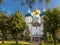 Shining cupola of orthodox monastery in summer day viewed from tree branches