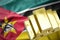 Shining golden bullions on the mozambique flag
