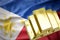 Shining golden bullions on the philippines flag