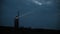 Shining lighthouse on the coast of the island in the evening