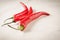 shining red hot pepper/red hot pepper on a white marble background. Selective focus and copyspace