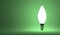 Shining torpedo light bulb on green