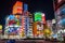 Shinjuku, Tokyo, Japan - December 24, 2018: View of cityscape at night with colorful advertisement billboard light beside the