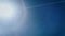 Shinkula pass aerial view: sun, snowy peaks, and sun halo