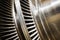 Shiny blades of high-speed steam turbine in workshop