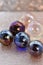 Shiny clear and coloured marbles with sparkling background