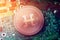 Shiny copper HDAC cryptocurrency coin on blurry motherboard background