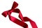 Shiny decorative red satin ribbon with bow on white background,