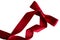 Shiny decorative red satin ribbon with bow on white background,