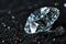 Shiny diamond on black background, one luxury brilliant sparkle on dark desk, white gemstone with reflections. Concept of jewel,