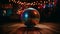 Shiny disco ball illuminates vibrant dance floor at nightclub party generated by AI