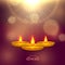 Shiny diwali festival greeting background with golden diya