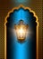 Shiny diwali lantern over blue background