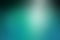 Shiny elegant blurred blue and black background with spotlight shine, beautiful teal or turquoise color