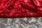 Shiny fabric on the border of red and silver
