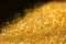 Shiny gold glitter, closeup