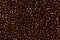 Shiny golden seed beads background.