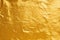Shiny golden yellow crumpled metallic foil repeat pattern