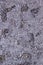 Shiny heavily wrinkled metal silver gray foil vertical texture background