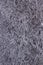 Shiny heavily wrinkled metal silver gray foil vertical texture background