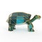 Shiny luxury crystal sapphire galapagos tortoise with edges framed golden wire, isolated
