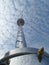 Shiny Main Mast under white cloudy sky