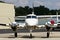 A shiny new private prop plane at an airport