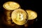 Shiny physical bitcoins on black background. Blockchain technology.