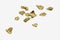 Shiny pieces of crumpled and creased gold foil or leaf isolated on a white background