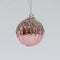 Shiny pink Christmas tree ball ornamented with tiny silver beads