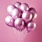 Shiny pink metallic balloons isolated on pink background. Card for wedding, woman\\\'s day, mothers day, valentine\\\'s da
