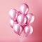 Shiny pink metallic balloons isolated on pink background. Card for wedding, woman\\\'s day, mothers day, valentine\\\'s da