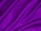 Shiny purple crumpled fabric texture. Elegant wavy cloth background