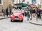 Shiny red antique Citroen makes way through Montmartre crowd, Pa