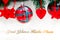 Shiny red christmas balls, heart and stars on white with pine tree with text. Yeni yiliniz kutlu olsun means happy new year