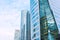 Shiny reflective business buildings and the blue sky with clouds