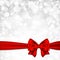 Shiny silver starry christmas background with red bow