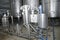 Shiny tank or barrel at a beer and wine factory. Industry Brewing and winemaking. Equipment .