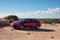 Shiny Toyota Corolla Sedan rental vehicle parked in deserts of Western Australia