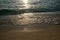 Shiny tropic sea wave on golden beach sand in sunset light,lipe