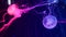 Shiny vibrant fluorescent jellyfish glow underwater, dark neon dynamic pulsating ultraviolet blurred background. Fantasy
