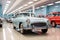 Shiny and well lit classic blue car parked in a car museum.Shiny and well lit classic cars parked in a car museum