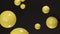 Shiny yellow bubbles are flying on a black background. Abstract loop animation