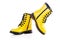 Shiny yellow leather shoes. Shining boots isolated