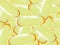 Shiny yellow vitamin omega3 fish oil capsule background.