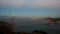 A ship approaches a misty moody looking golden gate bridge in san francisco