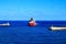 Ship approaching Valletta harbor in Malta between two lighthouses